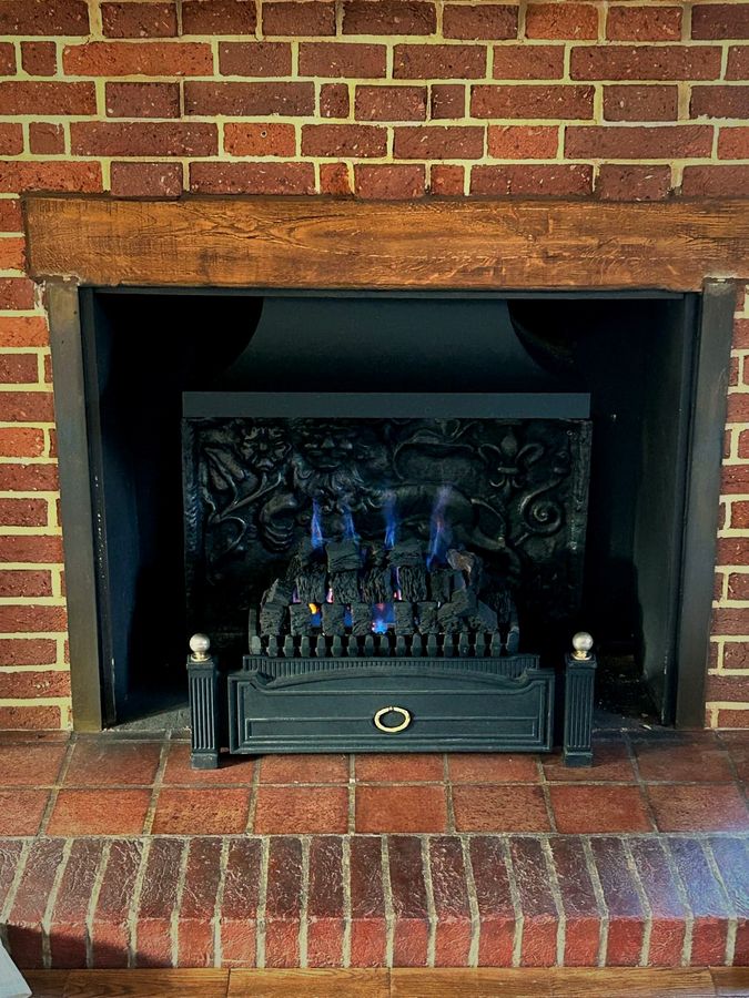 EmberCraft gas fire installation in Kent with brick and an oak mantel