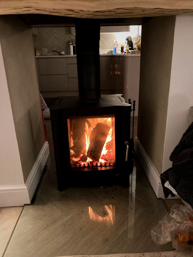 Roaring fire installed by EmberCraft in an open-plan Kent kitchen