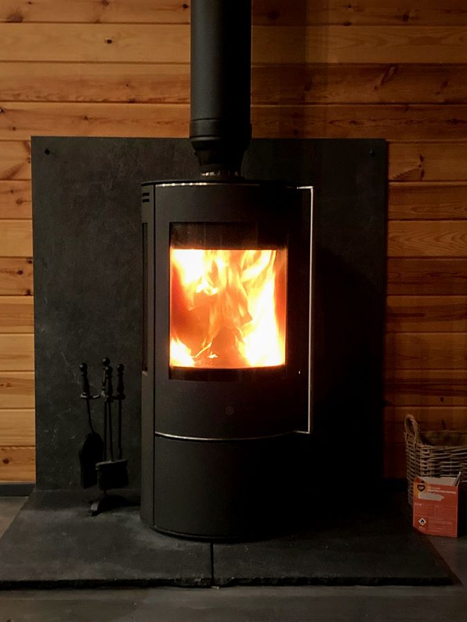 EmberCraft stove installation in Kent with a wood-clad chimney breast