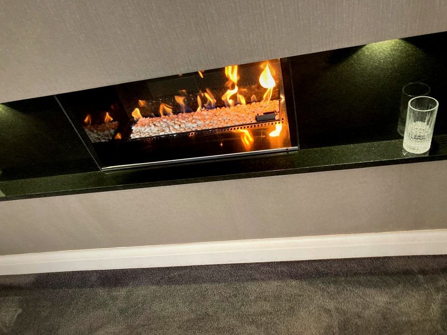 EmberCraft linear fire installation in Kent with black granite