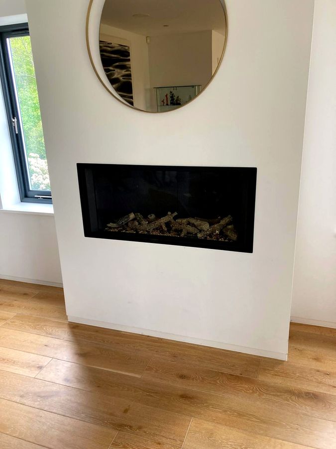 EmberCraft media wall installation in Kent with a mirrored surround