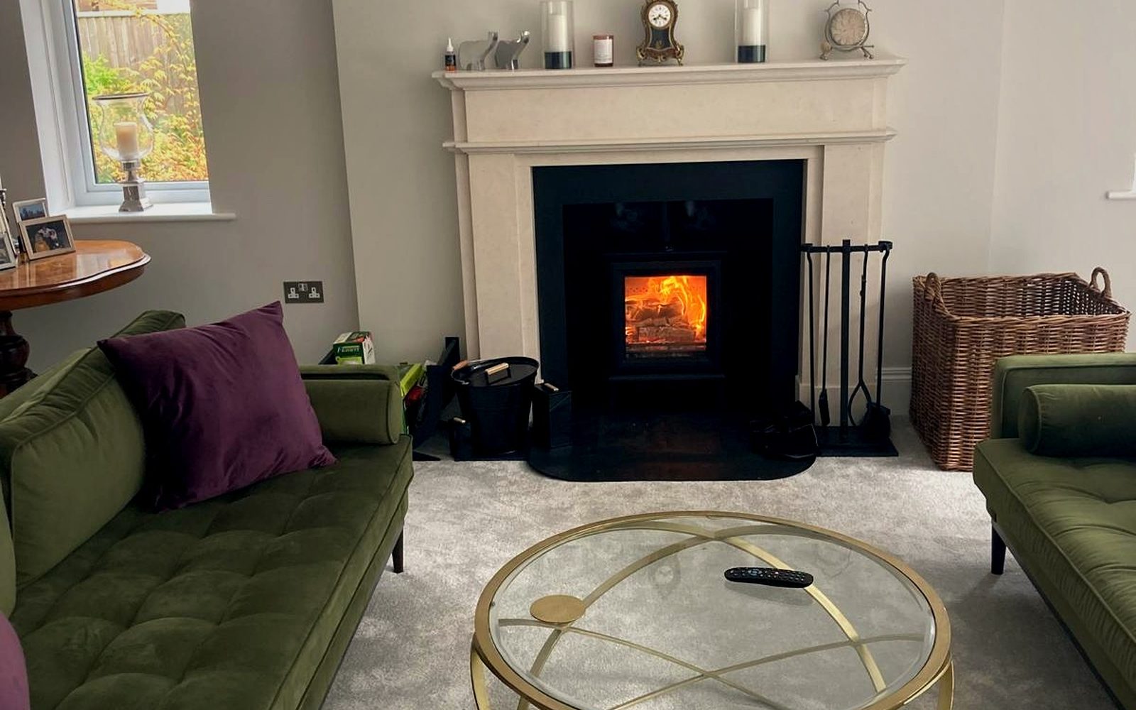 A fireplace in an open-plan living room, installed by EmberCraft, serving Sandwich, Kent